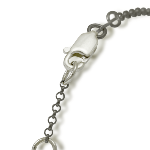 Close up of silver clasp for bracelet