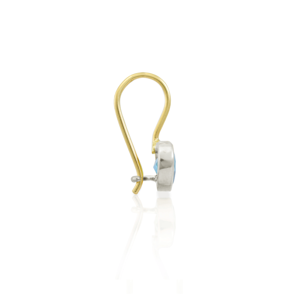Side view of Swiss Blue Topaz heart earring in silver and gold by Scarab Jewellery Studio