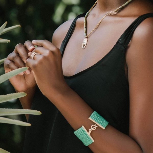Green Chrysoprase Woven Cuff Bracelet and Gold Scarab Natural Turquoise Bead Necklace shown on model by Scarab Jewellery Studio