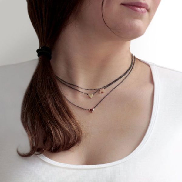 Gold Cross Necklace and Gold Heart Necklace on Model by Scarab Jewellery Studio