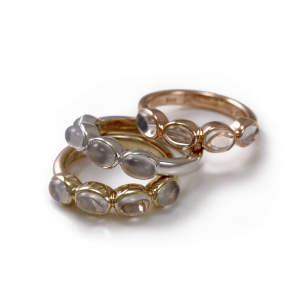silver rainbow moonstone ring with four moonstones shown with rose gold rainbow moonstone ring and yellow gold rainbow moonstone ring versions by Scarab Jewellery Studio