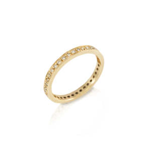 The Odine Full Eternity Ring is handmade in yellow gold and 37 white diamonds