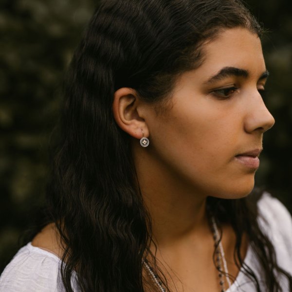 black and silver earrings with gold star detail - Image 3